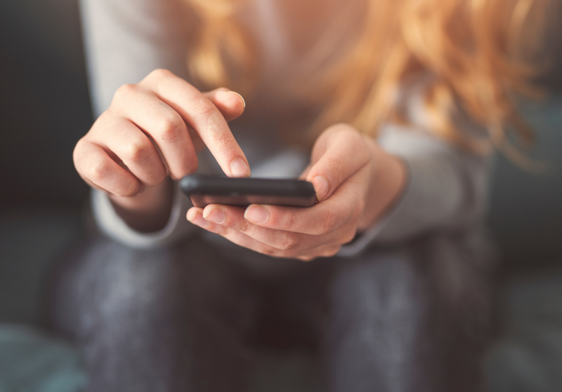 Woman using the Life Steps app on her phone